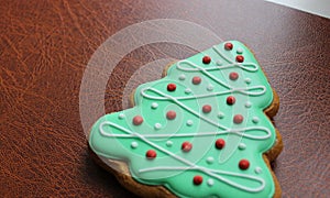 Pine Tree Cookie On Brown Leather Folder Concept Photo For New Year Business Greeting