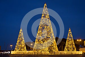 Pine tree from yellow lights . Christmas tree with lights glowing . Christmas decoration background with golden lights glowing .