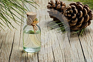 Pine turpentine essential oil in glass bottle