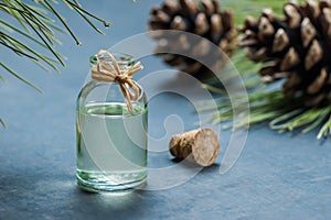 Pine turpentine essential oil in glass bottle photo