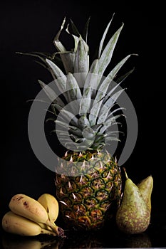 Pineapple, bananas and pears photo