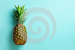 Pineapple on blue background. Top View. Copy Space. Pattern for minimal style. Pop art design, creative concept