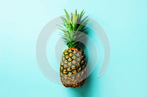 Pineapple on blue background. Top View. Copy Space. Pattern for minimal style. Pop art design, creative concept