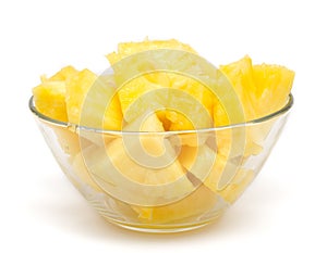 Pineapple chunks in the bowl isolated