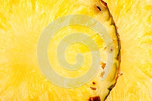 Pineapple circles closeup, background. Texture is brightly expressed.