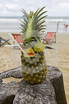 Pineapple, cocktail on the beach