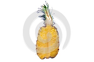 A pineapple cut in half isolated on white background. The Ananas comosus is a tropical plant with an edible fruit and the most