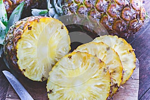 Pineapple fruit on wood table