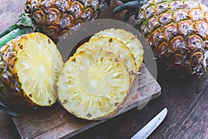 Pineapple fruit on wood table