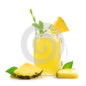 Pineapple juice in a mason jar with fruit, isolated on white