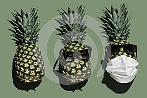 Pineapple ordinary, pineapple in sunglasses and pineapple in glasses with face mask.