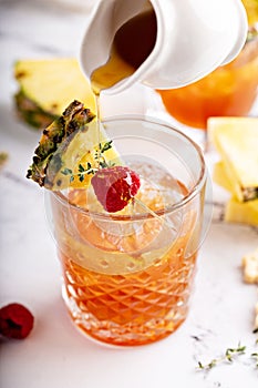 Pineapple, raspberry and honey cocktail or mocktail