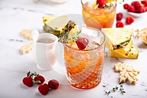 Pineapple, raspberry and honey cocktail or mocktail