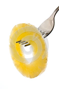 Pineapple ring on a fork