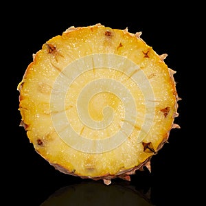 Pineapple set. Whole pineapple and slices isolated on black background.