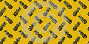 Pineapple with shadow on yellow seamless pattern.