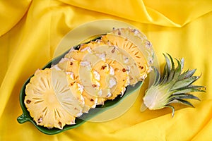 pineapple slice on plate for food fruit ripe pineapple on yellow background, fresh pineapple tropical fruits summer - top view