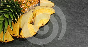 Pineapple on stone background top view