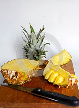 Pineapple on the wooden plate