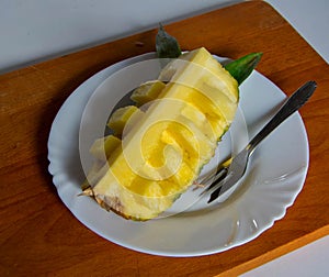 Pineapple on the wooden plate