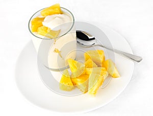 Pineapple yogurt with pineapple chunks