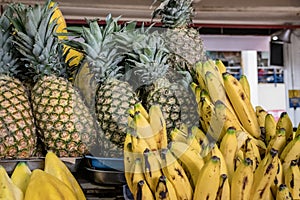 Pineapples and bananas on sale at the market
