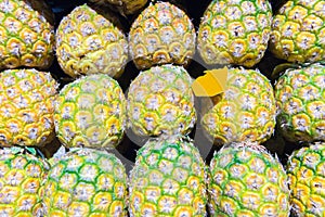 Pineapples on the market as a background