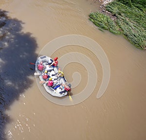 Pineios River rafting, Vale of Tempi, Thessaly, Greece. Tourist on a raft, brown water, above view