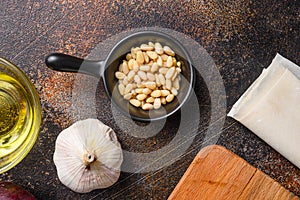 Pinenut nuts in black bowl top view