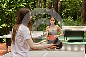 Ping pong players playing table tennis, sports and outdoor recreation, active leisure in the summer for teens