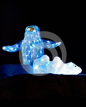 A pingouin and a polar bear made with some Christmas lights