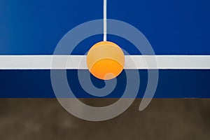 Pingpong ball hits the edge of a pingpong table