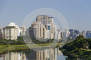 Pinheiros river and buildings photo