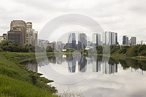 Pinheiros river and skyscrapers in Sao Paulo, Brazil photo