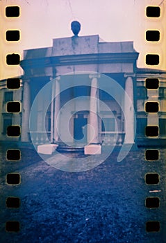 Pinhole photo of an old building on film