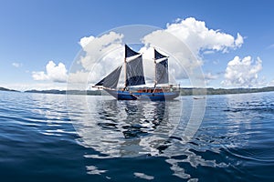 Pinisi Schooner Sailing in Calm Water, Raja Ampat