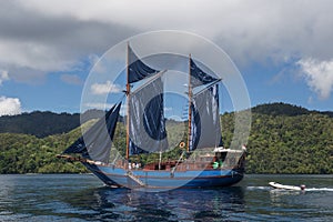 Pinisi Schooner With Sails Up in Calm Water, Raja Ampat