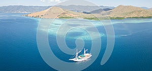 Pinisi Ship and Coral Reef in Indonesia