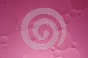 Pink abstract background with oil circles, streaks and gradient.