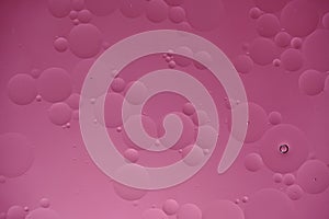 Pink abstract background with oil circles, streaks and gradient