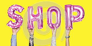 Pink alphabet balloons forming the word shop