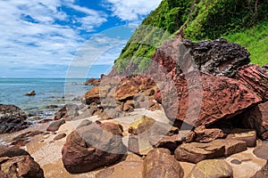 pink arkosic sandstone rocks by sea agianst blue sky, Chanthaburi