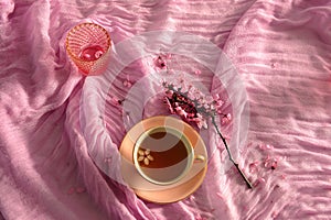 Pink Arrangement of Cherry Blossoms and Tea