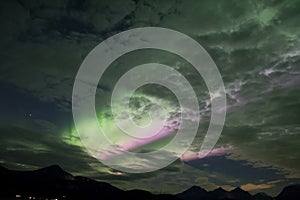 PINK AURORA BOREALIS BANDS IN THE ARCTIC SKY