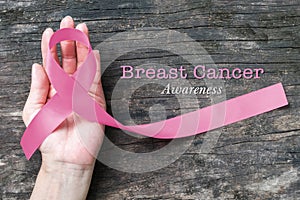 Pink awareness ribbon symbolic bow color raising support campaign on people living life with tumor Breast cancer