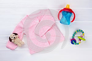 Pink baby girl shirt and toys