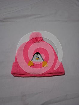 Pink baby outwear has a punguin pattern