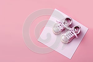 Pink baby shoes on pink background. Top view. Copy space. Ai generative