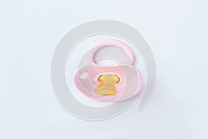 Pink baby silicone pacifier.