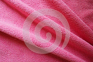 Pink background, soft microfiber texture fabric folds